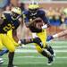 Michigan senior quarterback Denard Robinson carries the ball during the second half at Michigan Stadium on Saturday. Melanie Maxwell I AnnArbor.com